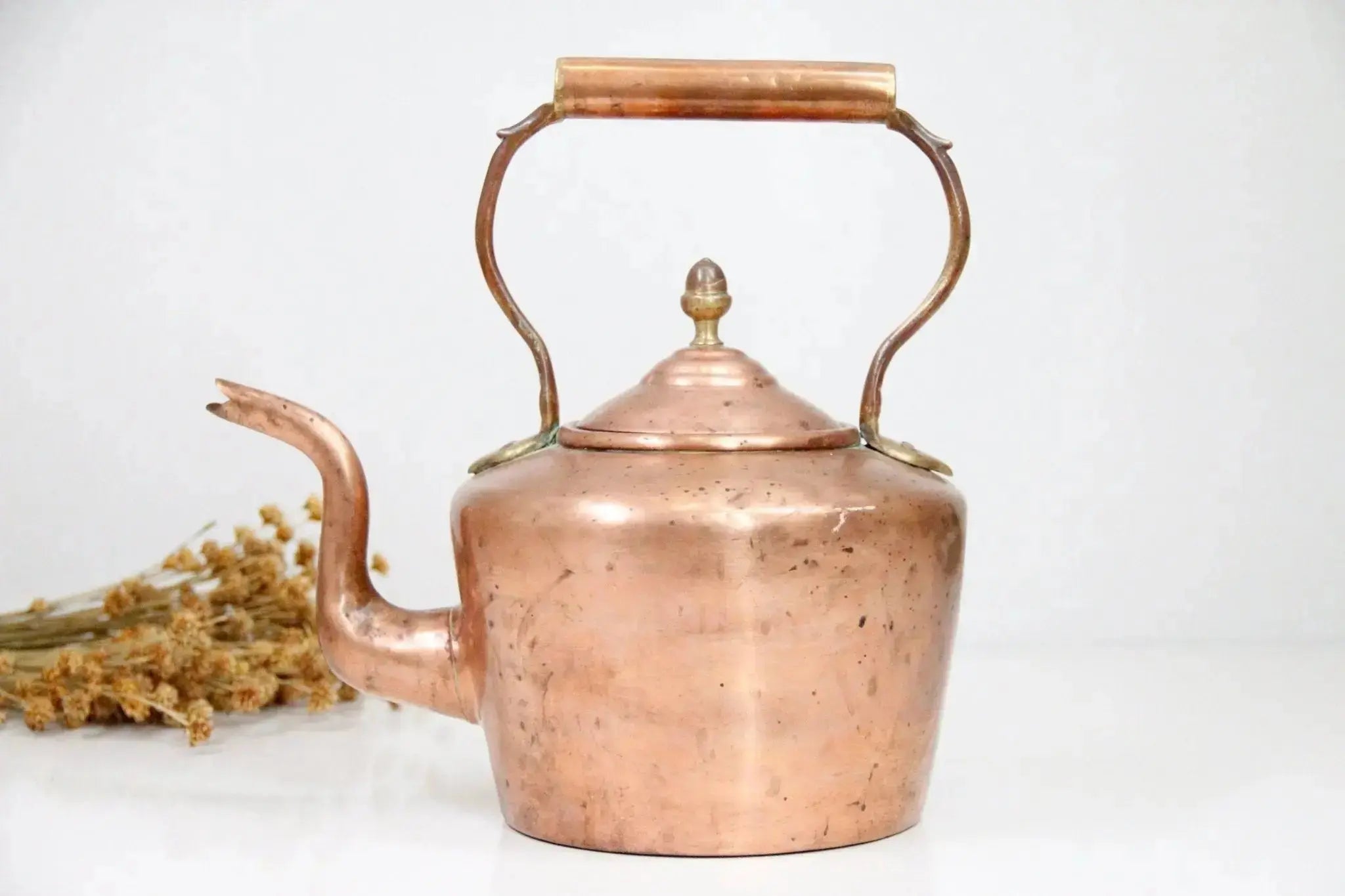 Antique copper kettle with original patina and brass handle